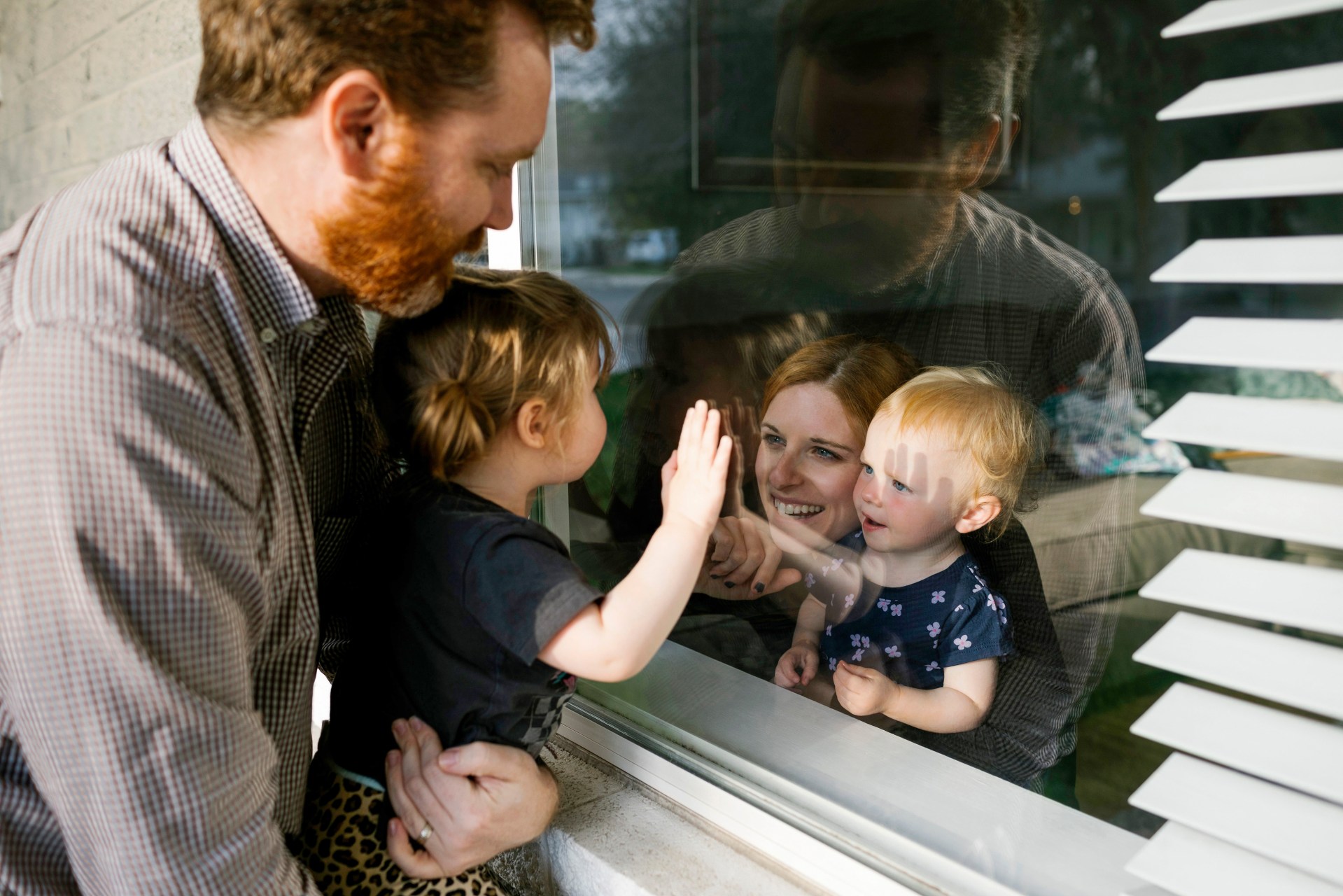 Celebration-of-life-family-through-window